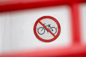 Bicycle with red circle and cross, symbolising denied access or rejection